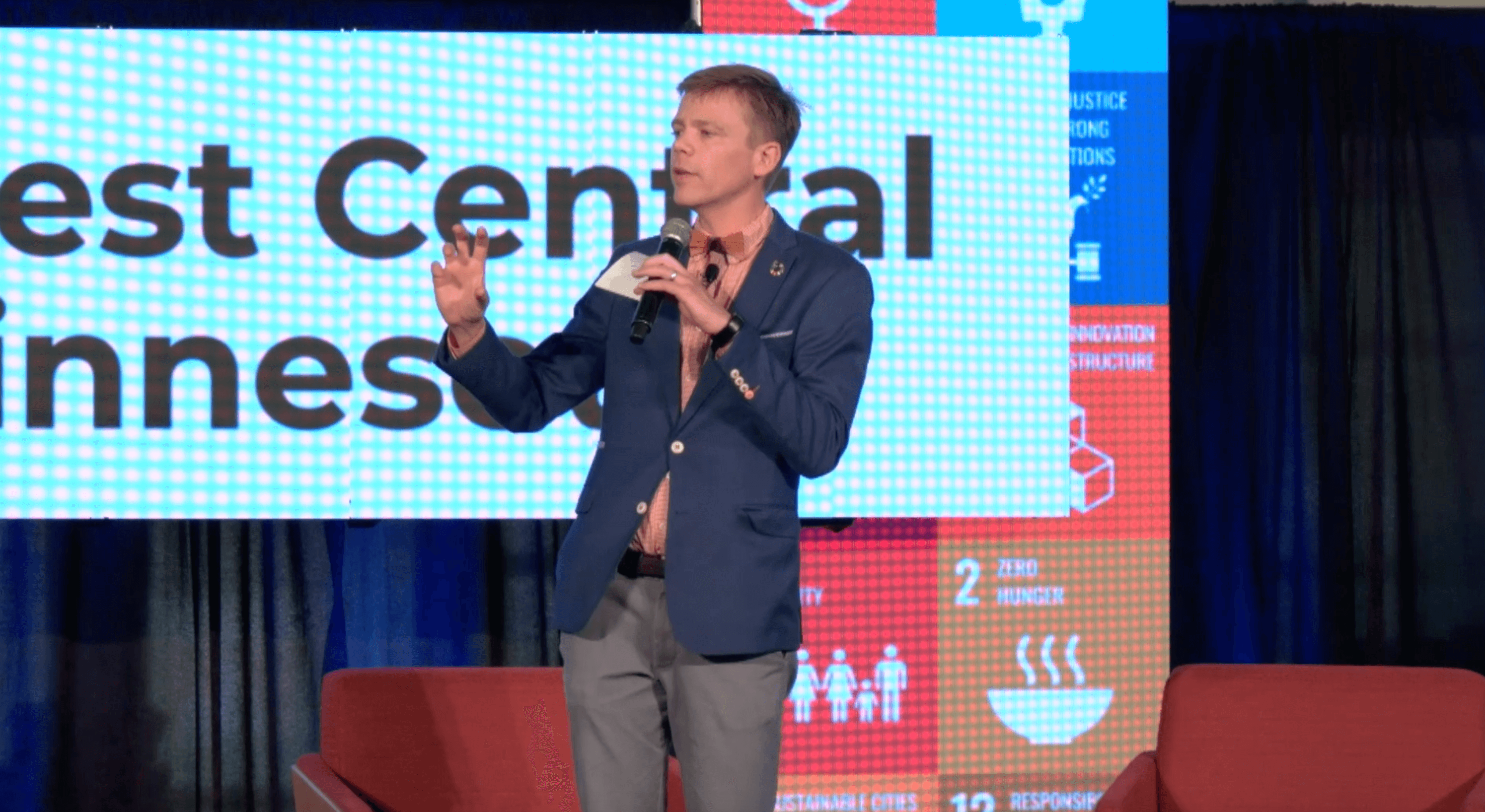 Tane Danger speaking on stage